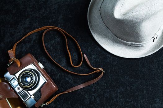 The image represents a set of objects related to photography on wooden background