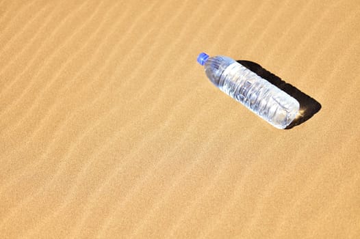 Bottle of water in Sahara
