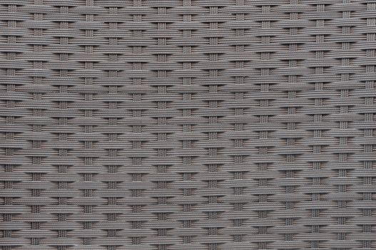 Background or texture made of woven plastic wicker pattern