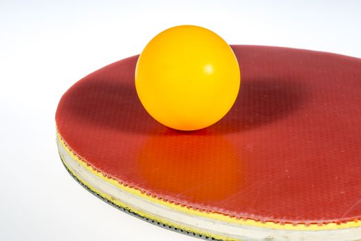 Table Tennis Ball and Paddle on white background.