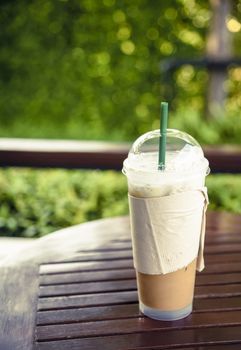 Iced tea with milk  on wood table