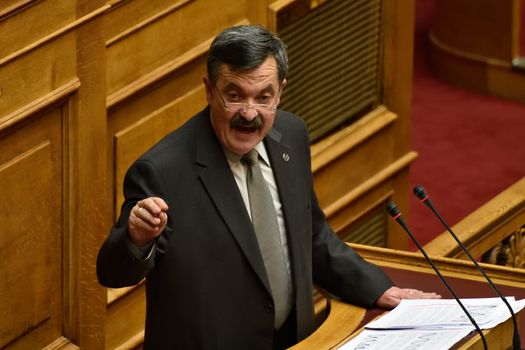 GREECE, Athens : Spokesperson Golden Dawn MP Christos Pappas addresses the MPs during a parliamentary session ahead of a voting, in Athens, Greece December 15, 2015. Greek parliament votes on reforms needed for the country to receive further financial aid from its international lenders. 
