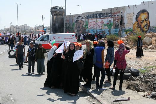 WEST BANK, Kalandia: Hundreds of activists from Palestine, Israel and from all over the world demonstrate on September 17, 2011 at the Kalandia checkpoint, which is the main corridor between Ramallah and Jerusalem, for the recognition of a state of Palestine by the UN. President Mahmoud Abbas is to ask UN for a recognition of Palestine as a state during the comng week. 