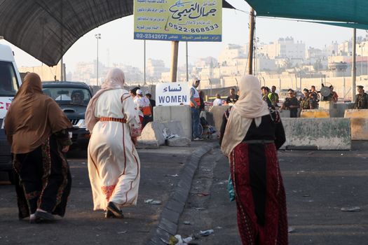 WEST BANK, Qalandia: Palestinians cross Qalandia checkpoint on the first friday of the Holy month of Ramadan on July 20, 2012.