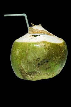 Fresh green coconut with straw