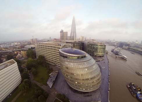 Aeral view on Thames river. The London City Hall in front and Leadenhal Building in the distance.