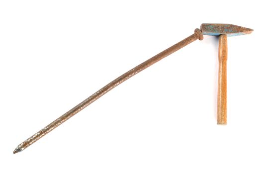 Small rusty hammer and big rusty nail