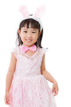 Chinese Little Girl in banny costume on plain white isolated background.