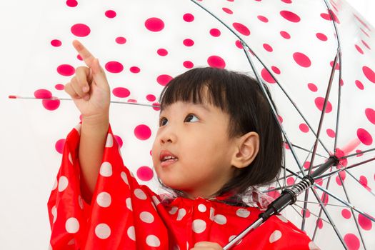 Chinese Little Girl Holding umbrella with raincoat in plain white isolated background.