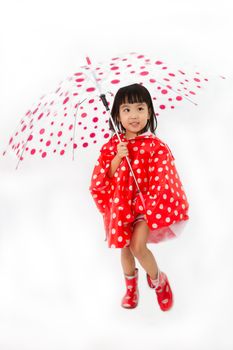 Chinese Little Girl Holding umbrella with raincoat in plain white isolated background.