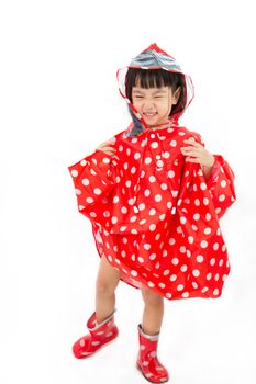 Chinese Little Girl Wearing raincoat and Boots in plain white isolated background.