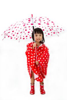 Chinese Little Girl Holding umbrella with raincoat in plain white isolated background.