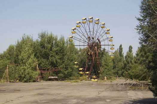 Ferris wheel in Pripyat - abandoned city near Chernobyl nuclear reactor. Whole city was abandoned after nuclear disaster on 26.04.1986