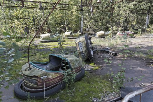 Playground in Pripyat - abandoned city near Chernobyl nuclear reactor. Whole city was abandoned after nuclear disaster on 26.04.1986

