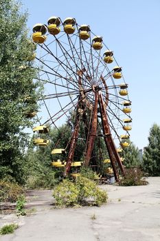 Ferris wheel in Pripyat - abandoned city near Chernobyl nuclear reactor. Whole city was abandoned after nuclear disaster on 26.04.1986
