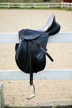 Saddle on the fence of the hippodrome