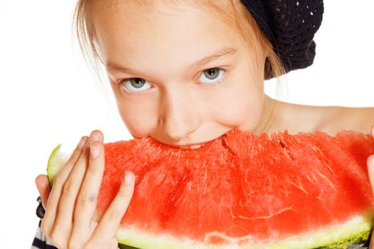 Cute girl eating red juicy watermelon, isolated on white 