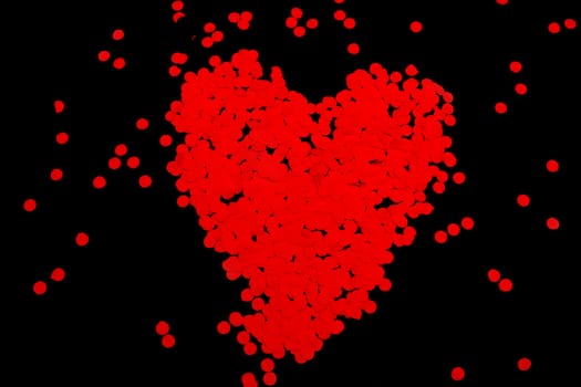 Red heart made of papers from paper puncher