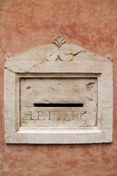 Decorative marble mailbox in the Italian town of Bergamo