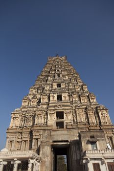 Virupaksha - Vijayanagar Temple - one of the highlight of the Hampi temple complex in India, with moon in the back