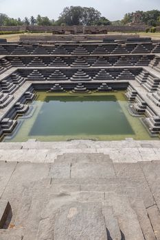 Stone water bath in Hampi temple complex in India