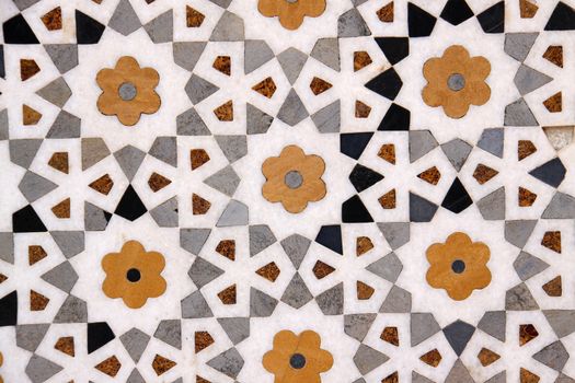 Marble flowers pattern on a wall in a temple in India