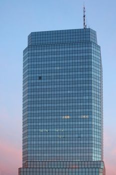 Corporate building in the city at sunset