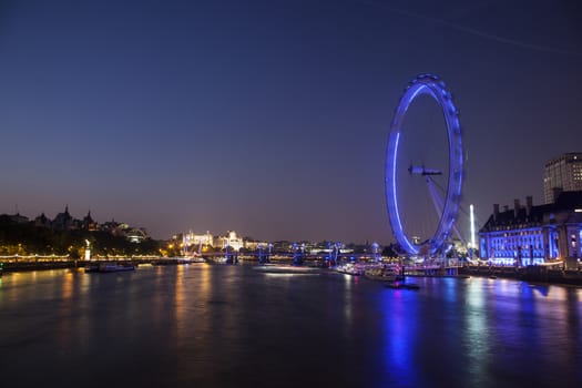 London Eye at dusk located on the south bank of River Thames. Long exposure photo.