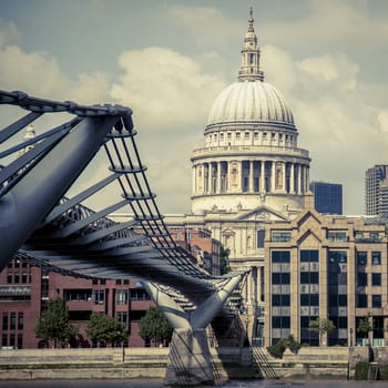 View on St Paul's Cathedral at the distance and Millennium bridge over Thames River.