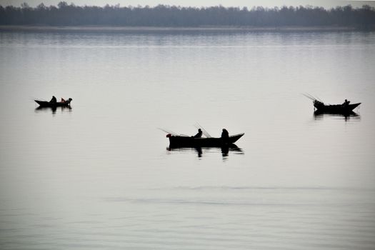 Fishermen in a boats on Lake Skadar in Montenegro.