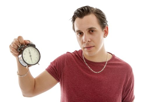 Young man is holding alarm clock at 6 o'clock over white background
