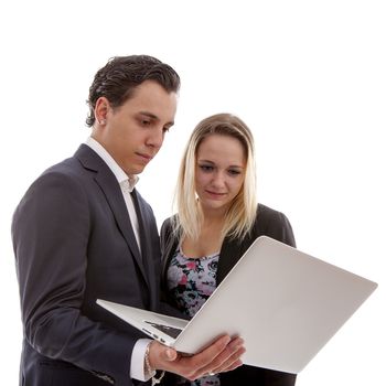 Young business couple is holding laptop over white background