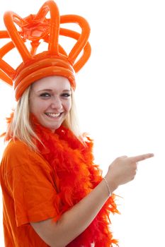 Young woman as Dutch orange supporter is showing something over white background