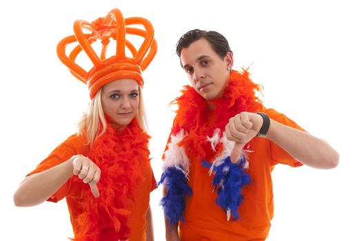 Couple of Dutch soccer supportersfeeling down over white background