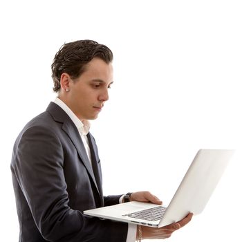 Young businessman is holding laptop over white background