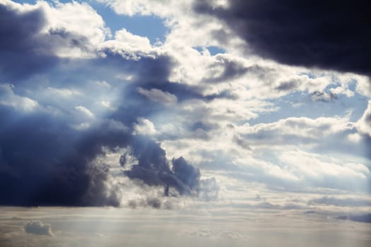 Dark clouds with bright rays of sunlight