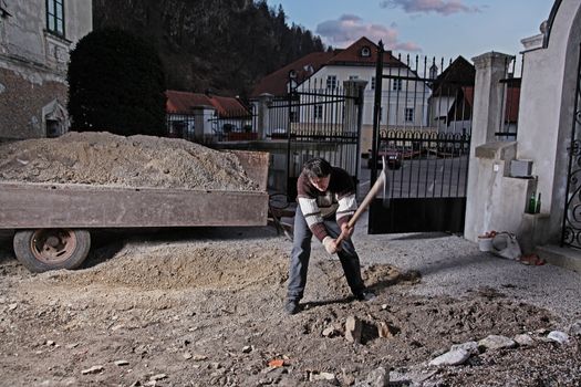 Man working in his courtyard