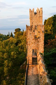 Piran fortres lit with sunset colours.