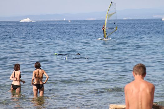 Sunbathing on a beach in Piran, Slovenia