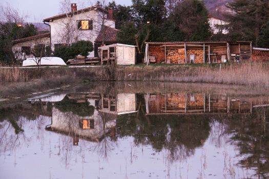 Saltpans with a house in the back (in Strunjan/Piran, Slovenia)