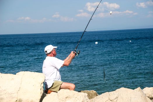 Fisherman in coastal town of Piran in Slovenia