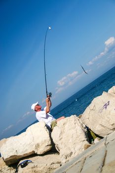 Fisherman in coastal town of Piran in Slovenia