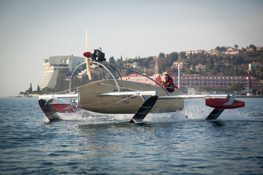 Motorised vessel on foils in the sea