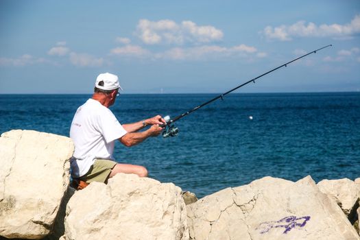 Fisherman in coastal town of Piran in Slovenia