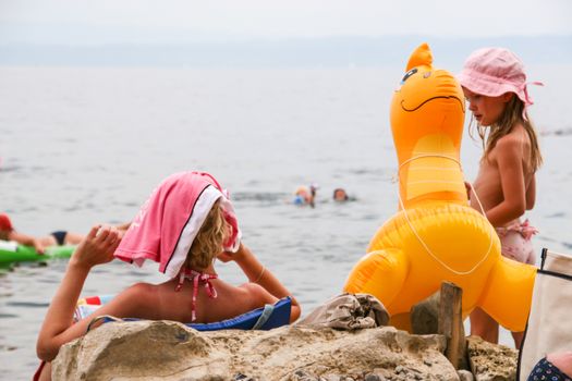 Sunbathing on a beach in Piran, Slovenia