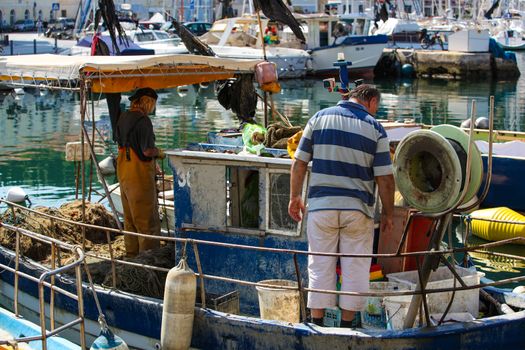 Fishermen in coastal town of Piran in Slovenia