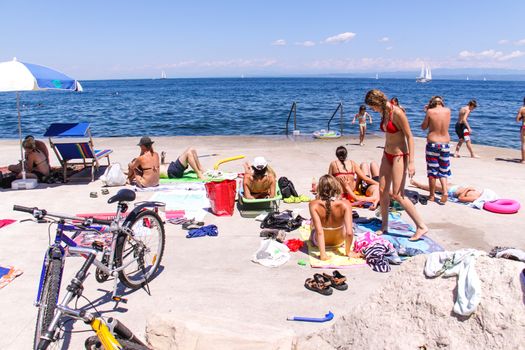 Sunbathing on a beach in Piran, Slovenia