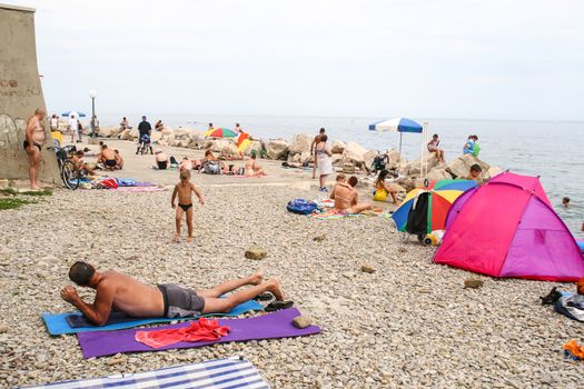 Sunbathing on a beach in Piran, Slovenia