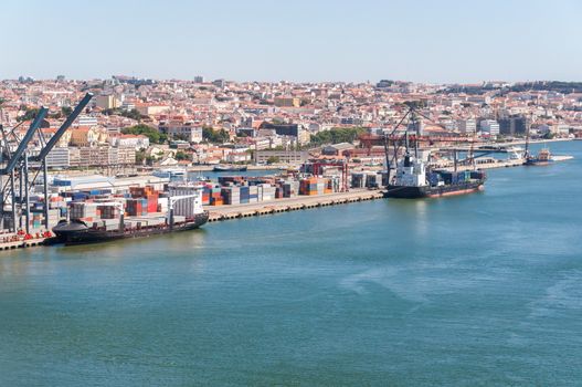 Container ships on loading terminal of Lisbon port on Tagus River