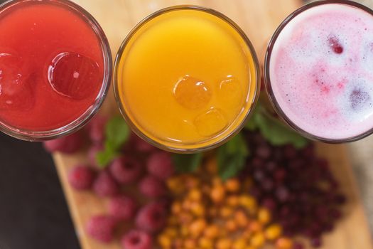 set of fruit non-alcoholic drink with cranberries raspberries and sea buckthorn
